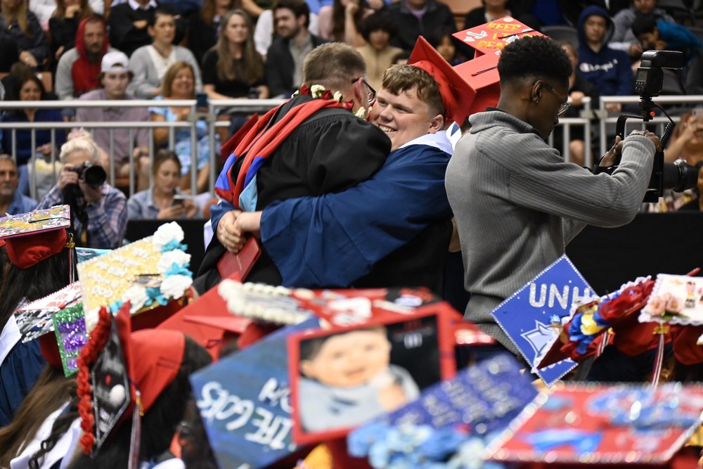 Memorial graduate celebrates receiving diploma by surprising principal with a giant hug