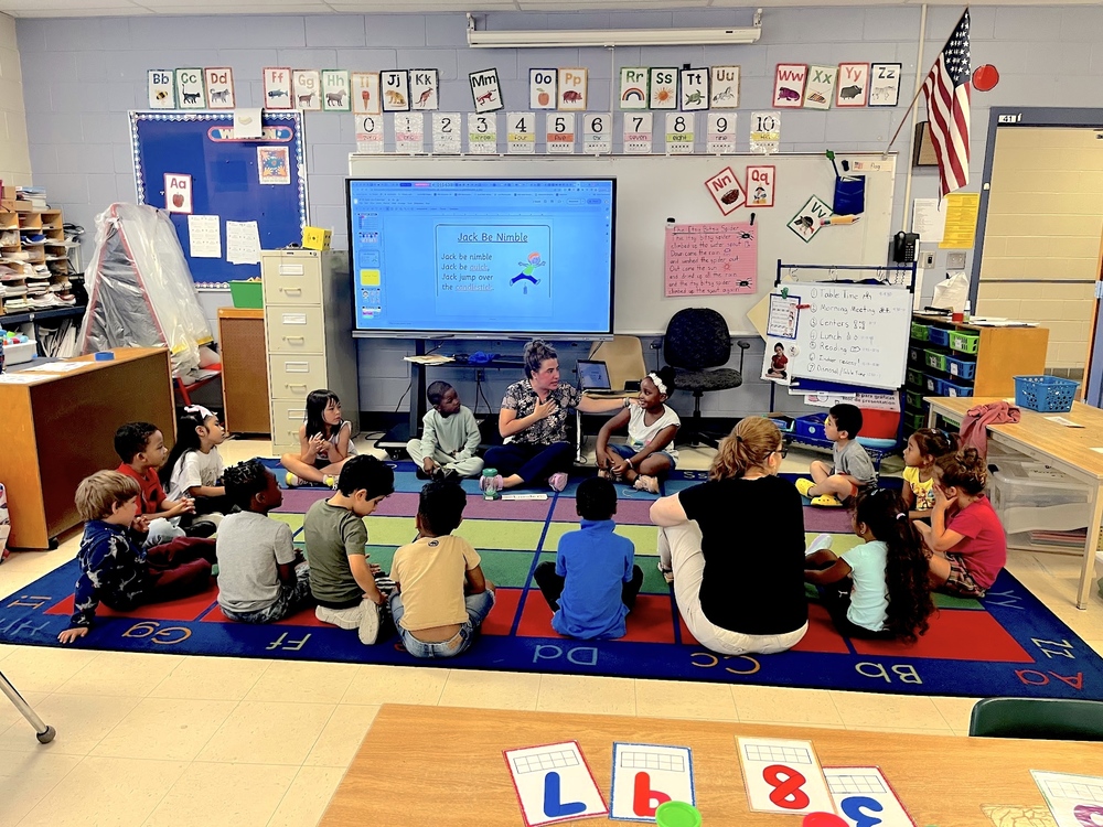 Students take part in "circle time" during the Blast Off to Kindergarten program this summer