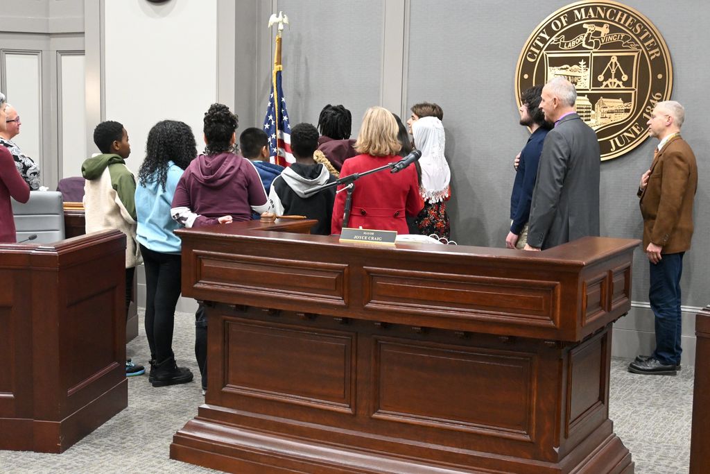students from McLaughlin Middle School lead the pledge of allegiance